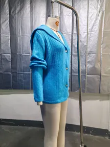 Side profile view of a vibrant blue ribbed knit cardigan featuring front buttons on a mannequin