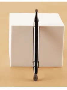 Dual-ended portable lip brush retractable lipstick brush with cap for precise makeup application.