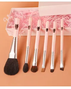 Detail view of a 6-piece pink makeup brush set with cute bear handle designs, soft bristles.