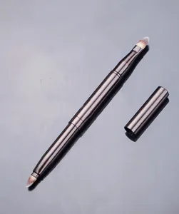 Double-ended retractable lip brush with cap, portable metal makeup brush for precise application.