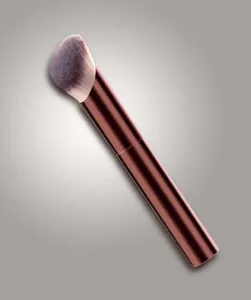 Professional angled foundation makeup brush with long metallic handle for flawless finish.