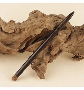 Detail view of the CHICHODO round eye blending makeup brush with soft natural bristles on wood.