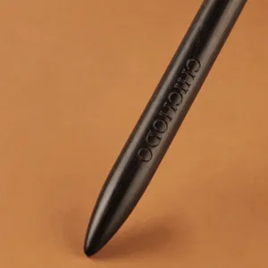 Ebony wood handle eyeshadow detail brush, handcrafted natural wood texture for precise eye makeup.