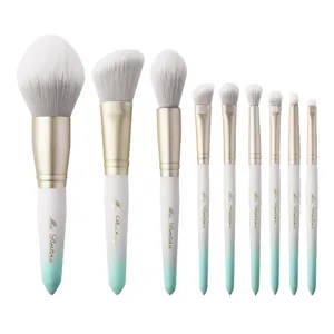Professional 9-piece gradient mint white makeup brush set with soft dense bristles.