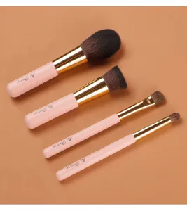 Detailed view of pink makeup brush set, featuring four soft bristle brushes for daily use.