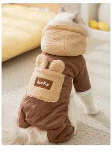 Close-up of warm pet jumpsuit with cozy fleece hood and cute bunny ears pocket detail.