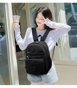 Detail view of a stylish black nylon casual backpack, perfect for daily commute and travel use.