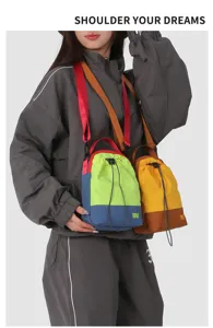 Detailed view of the colorful outdoor drawstring shoulder bag worn across the body, stylish.