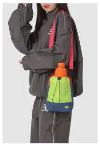 Mountain style crossbody shoulder bag with water bottle for outdoor travel and daily commute.