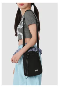Black crossbody shoulder bag with drawstring closure, compact minimalist mobile phone bag design.