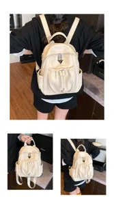Detail view of the beige PU leather casual backpack, showing texture and pocket design.