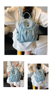 Stylish light blue leather backpack for women, large capacity travel daypack with front pocket.