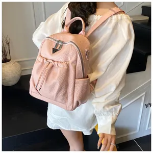 Stylish pink PU leather casual women backpack detail, featuring metal zippers and front pocket.