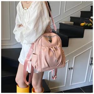 Stylish pink leather backpack with large capacity, trendy travel daypack for women daily use.