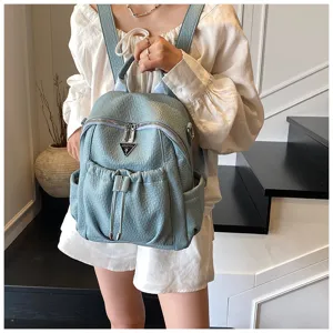 Chic women's light blue PU leather backpack, large capacity stylish travel daypack.
