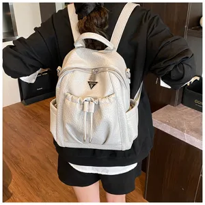Stylish women's leather backpack with large capacity, trendy grey travel daypack for daily use.