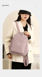 Casual nylon backpack in light purple, featuring front zipped pocket and comfortable straps.