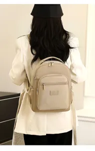 Casual nylon backpack for women stylish travel bag and schoolbook daypack in khaki color.