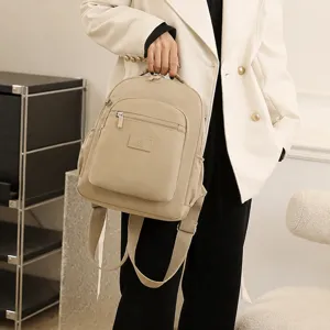 Casual nylon backpack for women, lightweight travel daypack with front zip pocket and sturdy straps.