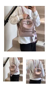 Casual women's pink leather backpack, stylish school bag and travel daypack for daily fashion look.