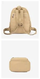 Detail view of khaki casual backpack showing straps and zipper pockets, solid color.