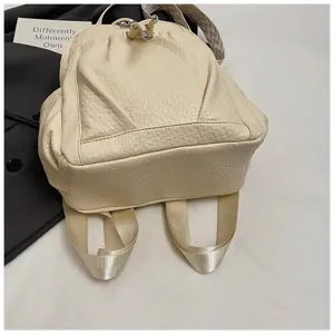 Beige soft leather backpack detail with drawstring closure and stylish wide shoulder straps.