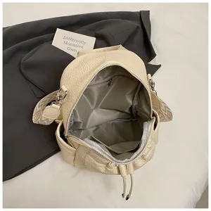Casual beige leather women backpack with large capacity and stylish design for daily travel.
