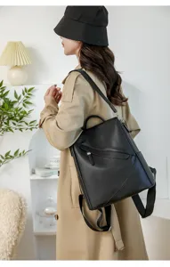 Minimalist black leather backpack for women, large capacity anti theft design for daily use.
