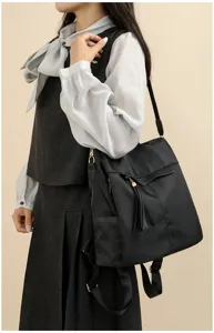 Sac a dos noir pour femme decontracte anti-vol sac de voyage leger avec details de glands.