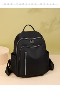 Black nylon casual backpack for women, large capacity waterproof travel book bag detail.