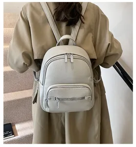 Soft leather women backpack detail view featuring convenient front zip pockets and smooth zippers.