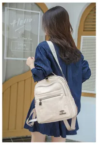 Stylish casual oxford cloth backpack for women, lightweight large capacity travel school daily bag.