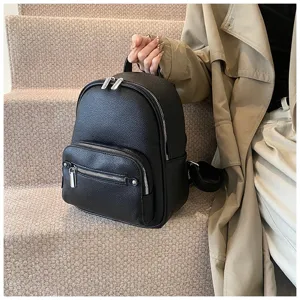 Women's black soft leather backpack, trendy casual daypack with multiple zippered compartments.