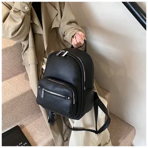 Women's black soft leather backpack, stylish casual daily daypack with zipper pockets.