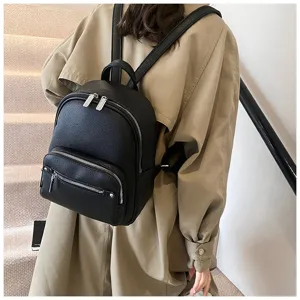 Detailed view of women's stylish black leather casual backpack, showing soft texture.