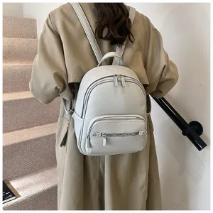 Stylish women's soft leather backpack, trendy casual daily daypack with metal zippers.