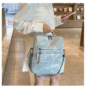 Fashion soft leather vintage women backpack with tassel and geometric straps for travel daily use