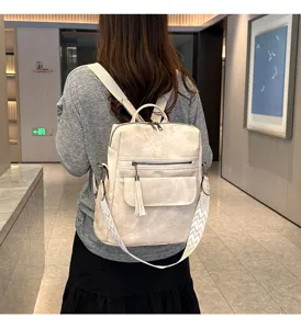 Stylish women retro soft leather backpack with tassel, multi-functional casual travel bag.