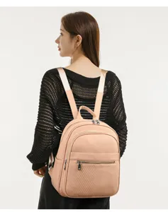 Sac à dos en cuir décontracté pour femme, cartable rose élégant avec poches zippées et bretelles.