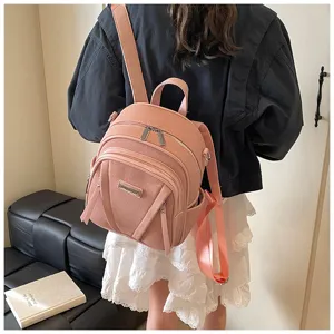 Stylish pink leather women's backpack with multiple zipper pockets for daily use detail view.