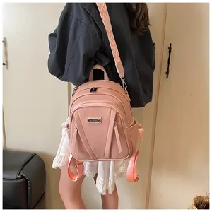 Women casual pink leather backpack with wide strap, large capacity stylish daily school bag.