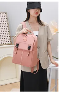 Zaino casual in nylon rosa da donna, grande capacità borsa scolastica elegante con fibbie.