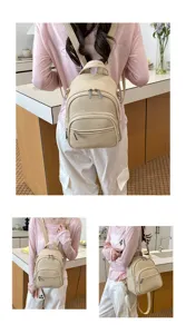 Minimalist casual women's PU leather backpack detail view showing front zipper pocket.
