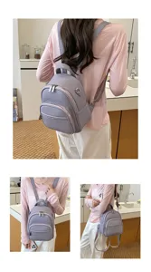 Detailed view of women casual purple PU leather backpack showing multiple pockets and zippers.