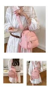 Stylish pink leather mini backpack for women, casual daily daypack with wide strap.