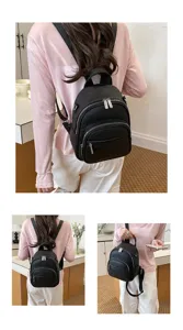 Women's casual black leather backpack, stylish minimalist daily school and travel daypack.