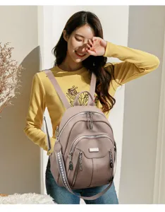 Detail shot of a stylish leather backpack with multi zippers, ideal for casual travel and daily wear.