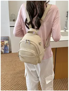 Casual beige leather backpack, stylish women's daily commuter daypack with zipper pockets.