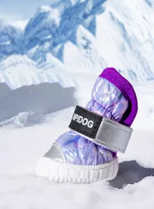 Warm winter pet snow boots with fleece lining, gradient reflective design, and anti-slip sole.