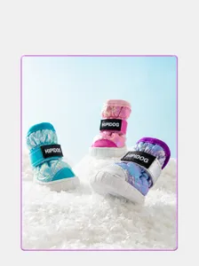 Close-up detail of winter warm plush-lined gradient metallic pet dog snow boots with secure strap.